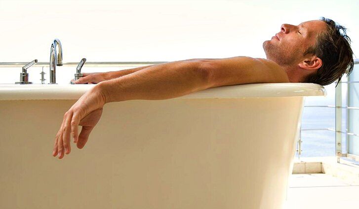 A man takes a shower with soda water